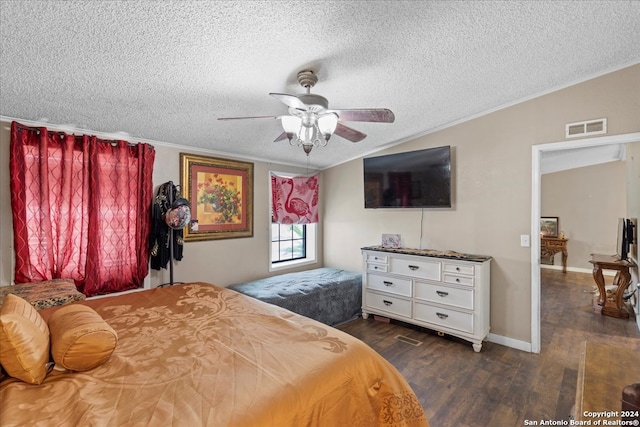 bedroom with ceiling fan, dark hardwood / wood-style flooring, ornamental molding, and a textured ceiling