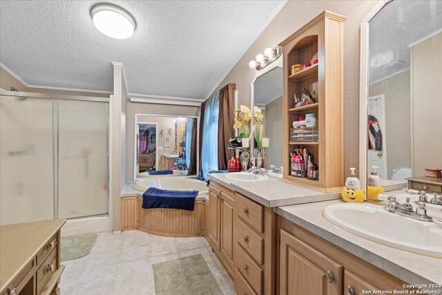 bathroom with a textured ceiling, crown molding, vanity, tile patterned flooring, and plus walk in shower