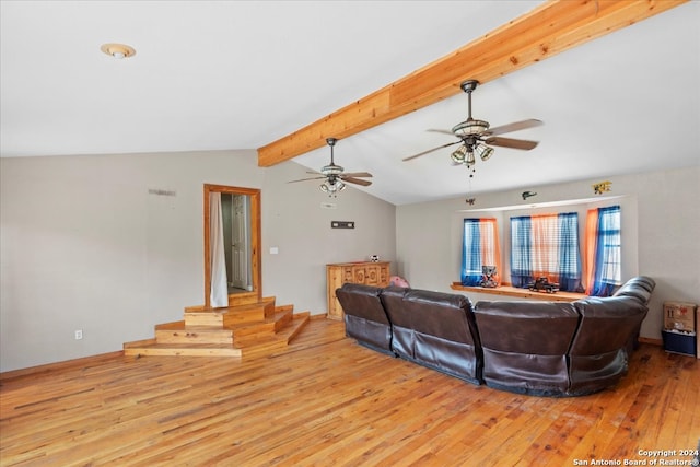 living room with vaulted ceiling with beams, light hardwood / wood-style flooring, and ceiling fan