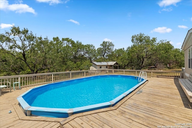 view of pool with a deck