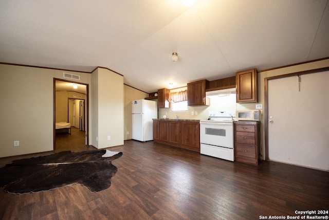 kitchen featuring white appliances, dark hardwood / wood-style flooring, and lofted ceiling