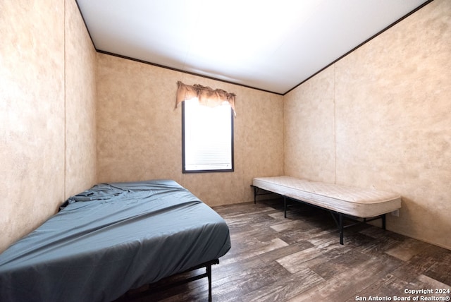 bedroom featuring dark hardwood / wood-style flooring