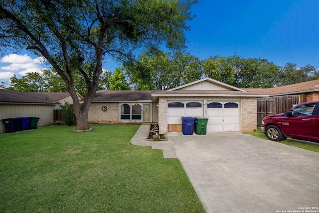 ranch-style house with a front lawn and a garage