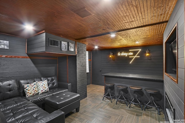223 E Craig Pl, San Antonio, TX 78212 - cinema room with wooden ceiling, wooden walls, and a bar