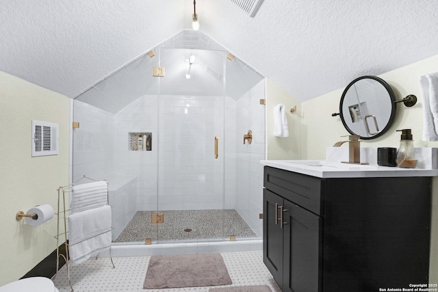 223 E Craig Pl, San Antonio, TX 78212 - full bath featuring vaulted ceiling, vanity, a shower stall, and a textured ceiling
