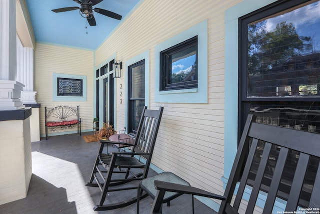 exterior space with ceiling fan and a porch