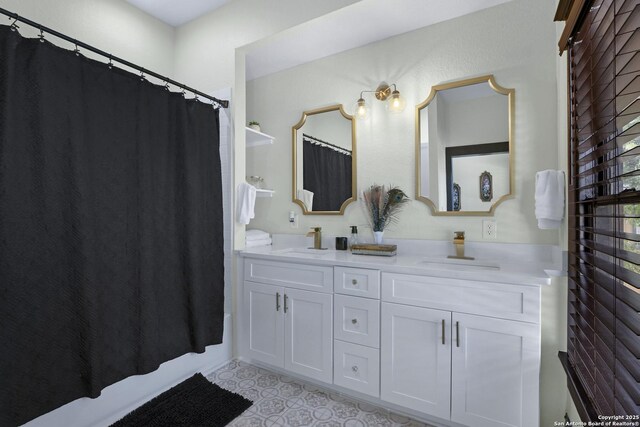 223 E Craig Pl, San Antonio, TX 78212 - bathroom featuring double vanity and a shower with curtain