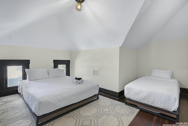 223 E Craig Pl, San Antonio, TX 78212 - bedroom with vaulted ceiling and wood finished floors