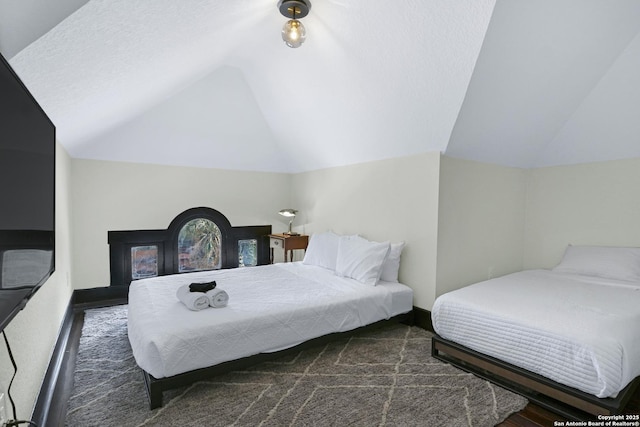 223 E Craig Pl, San Antonio, TX 78212 - bedroom with vaulted ceiling and wood finished floors