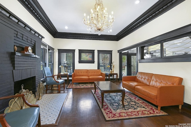 223 E Craig Pl, San Antonio, TX 78212 - living area with crown molding, healthy amount of natural light, wood finished floors, a chandelier, and a brick fireplace