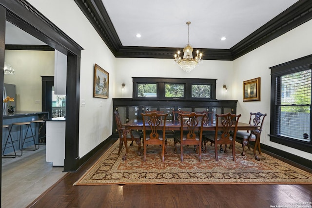223 E Craig Pl, San Antonio, TX 78212 - dining area with crown molding, plenty of natural light, a chandelier, and wood finished floors