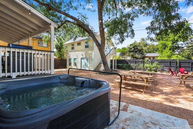 view of pool with a hot tub and a patio area