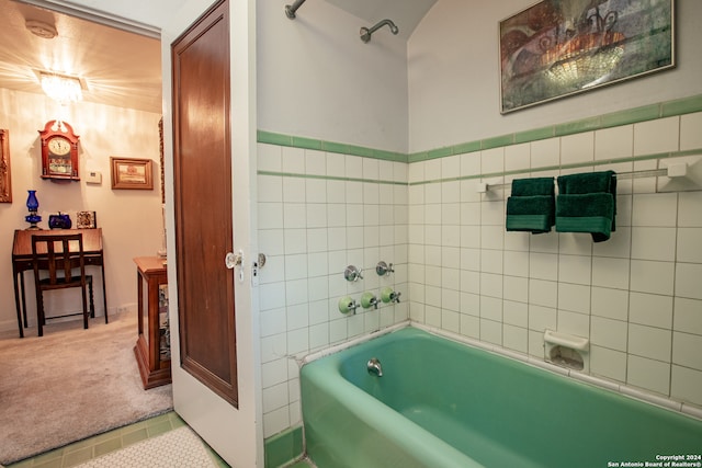 bathroom with tile patterned floors, tile walls, and bathtub / shower combination