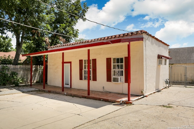 view of side of home with a patio area