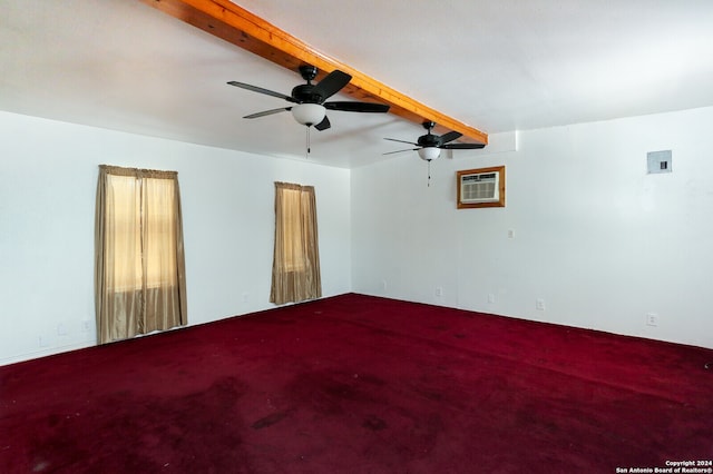 carpeted empty room with beam ceiling, ceiling fan, and a wall mounted air conditioner