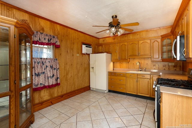 kitchen with appliances with stainless steel finishes, ornamental molding, ceiling fan, sink, and a wall unit AC