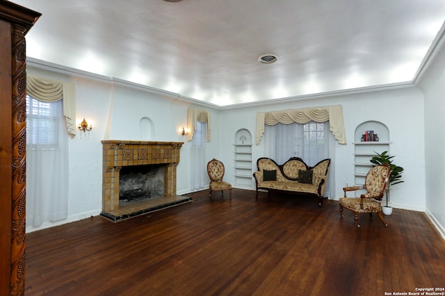 living room with a fireplace and hardwood / wood-style flooring