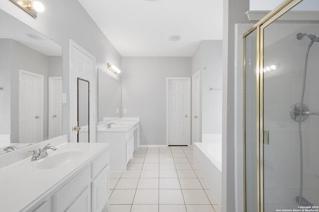 bathroom with shower with separate bathtub, tile patterned floors, and vanity