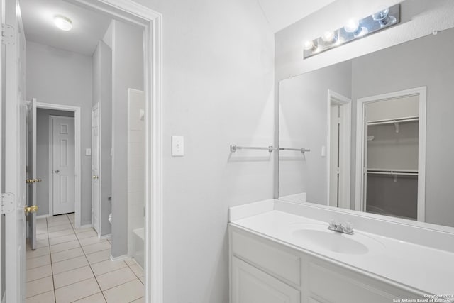 bathroom with tile patterned flooring and vanity