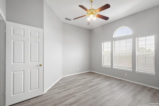 unfurnished room featuring ceiling fan and light wood-type flooring