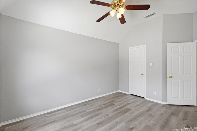 unfurnished room featuring lofted ceiling, ceiling fan, and light hardwood / wood-style flooring