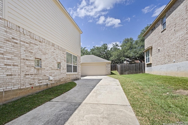 view of property exterior featuring a yard and a garage