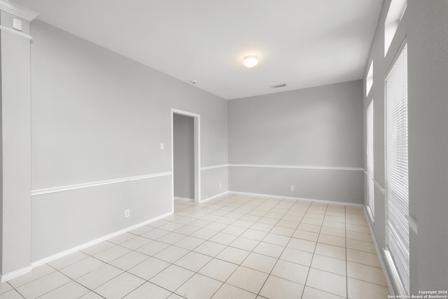 spare room with light tile patterned floors