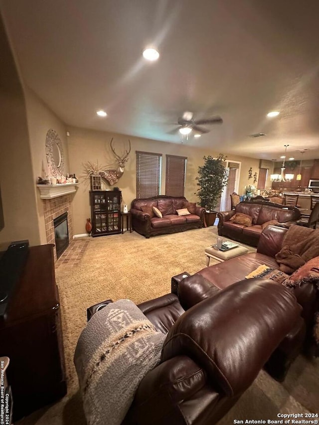 carpeted living room featuring a fireplace, recessed lighting, and a ceiling fan