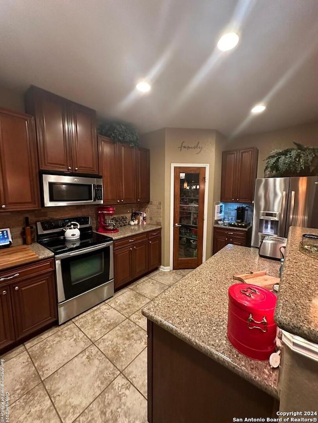 kitchen featuring recessed lighting, tasteful backsplash, and appliances with stainless steel finishes