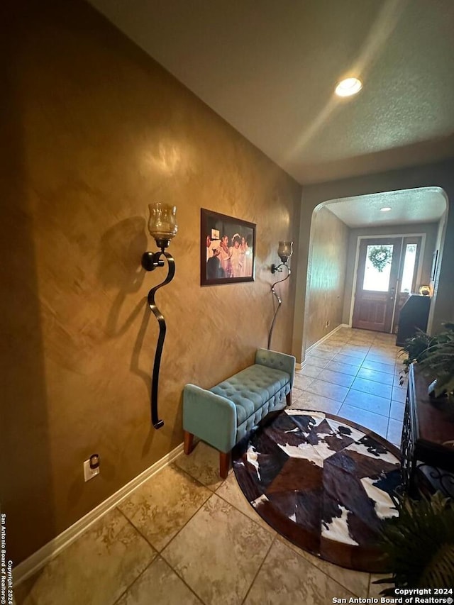 foyer featuring tile patterned flooring