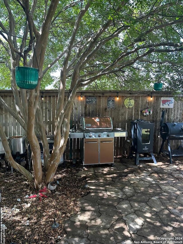 exterior space featuring a patio, area for grilling, and sink