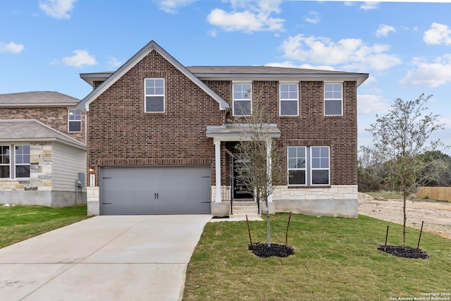 view of front of property with a garage and a front lawn