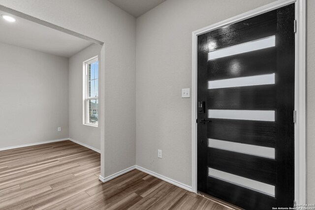 interior space featuring ceiling fan, a textured ceiling, and dark hardwood / wood-style floors