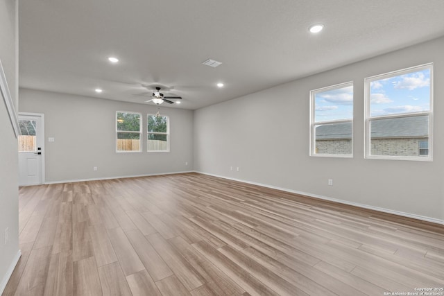 unfurnished living room featuring light hardwood / wood-style flooring and ceiling fan