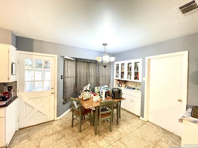 dining room featuring a chandelier