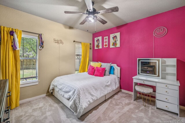 carpeted bedroom featuring ceiling fan