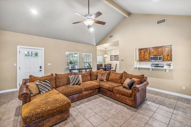 tiled living room with beam ceiling, high vaulted ceiling, and ceiling fan