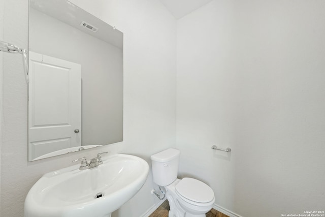 bathroom featuring sink and toilet