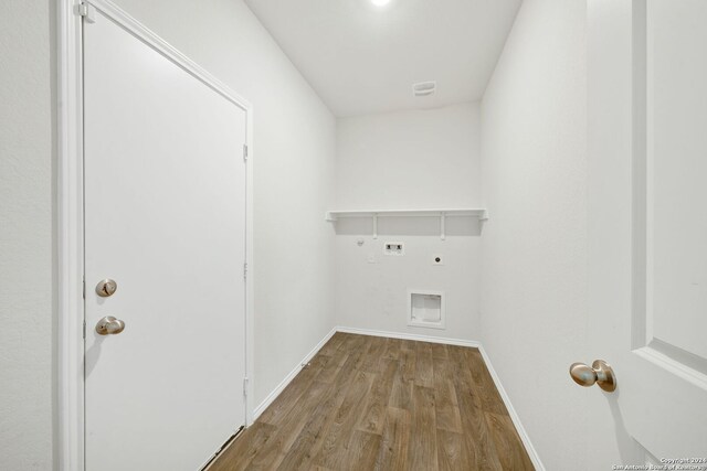 laundry area featuring electric dryer hookup, gas dryer hookup, wood-type flooring, and hookup for a washing machine