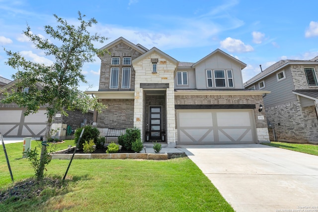 view of front of home with a front yard and a garage