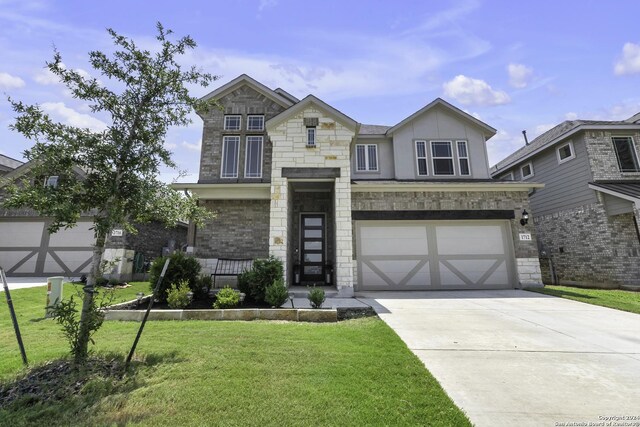 view of front facade with a front yard and a garage