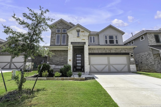 view of front of home with a front yard and a garage