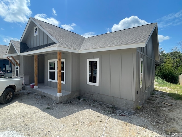 view of property exterior with a porch