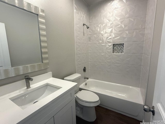 bathroom with vanity, bathing tub / shower combination, toilet, and wood finished floors