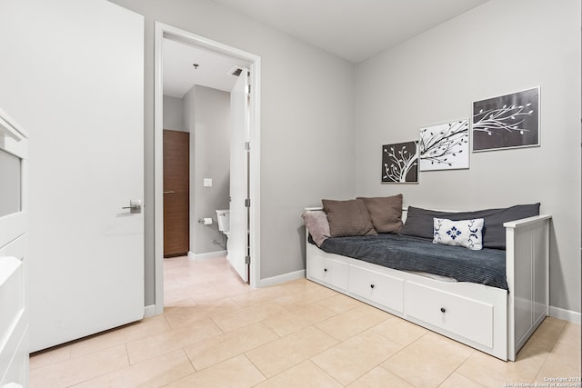 bedroom with light tile patterned flooring