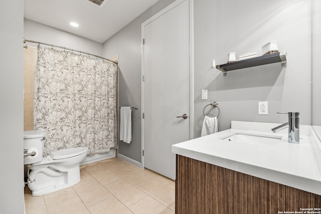 bathroom with tile patterned floors, vanity, and toilet