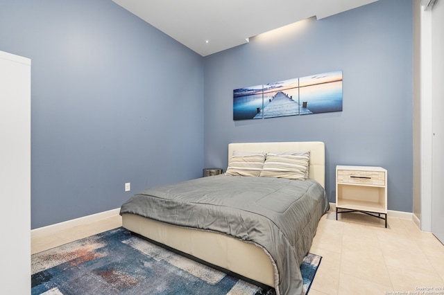 bedroom with light tile patterned floors