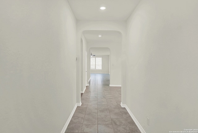 corridor with light tile patterned flooring