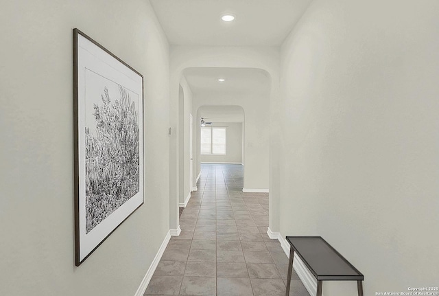 corridor with light tile patterned floors