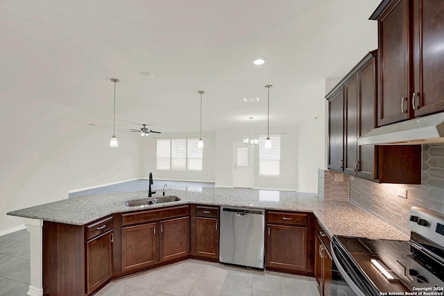 kitchen with kitchen peninsula, stainless steel appliances, decorative light fixtures, sink, and tasteful backsplash